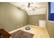 Bonus room with wood floors, a ceiling fan, and a cozy attic entrance at 5515 S Roxboro St # 23, Durham, NC 27713