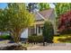 Beautiful end-unit townhome with manicured landscaping and mature trees at 5515 S Roxboro St # 23, Durham, NC 27713