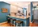Stylish kitchen island with bar seating complements the modern design and granite countertops at 5515 S Roxboro St # 23, Durham, NC 27713