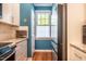 Well-designed kitchen area with a door leading to the outside and stainless steel refrigerator at 5515 S Roxboro St # 23, Durham, NC 27713