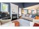Open concept living room featuring a fireplace and connection to the kitchen and dining area at 5515 S Roxboro St # 23, Durham, NC 27713