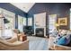 Living room with fireplace, large windows, and comfortable seating at 5515 S Roxboro St # 23, Durham, NC 27713
