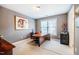 Comfortable home office with modern desk, neutral paint, and bright window at 5515 S Roxboro St # 23, Durham, NC 27713