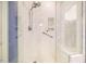 Modern shower with white marble tile, a built-in bench, and sleek chrome fixtures at 5515 S Roxboro St # 23, Durham, NC 27713