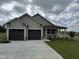 Charming home with a two-car garage and well-manicured lawn at 56 Ruskin Dr, Smithfield, NC 27577
