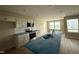 Modern kitchen with stainless steel appliances, white cabinets, and a center island at 56 Ruskin Dr, Smithfield, NC 27577