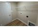 Convenient laundry room with a door and shelving at 56 Ruskin Dr, Smithfield, NC 27577