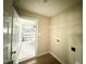 Convenient laundry room with shelving and easy access to the garage at 56 Ruskin Dr, Smithfield, NC 27577
