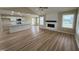 Bright living room with fireplace and seamlessly combines with kitchen at 56 Ruskin Dr, Smithfield, NC 27577