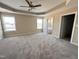 An ample main bedroom with plush carpet, natural light, and convenient en-suite access at 56 Ruskin Dr, Smithfield, NC 27577