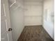 A well-organized walk-in closet offering substantial storage solutions with shelving and hanging space at 56 Ruskin Dr, Smithfield, NC 27577