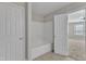 Bathroom featuring a shower and tub combo with tile surround at 5609 Severn Grove Dr, Durham, NC 27703