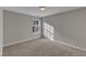 Bedroom with carpet flooring and a window, letting in natural light at 5609 Severn Grove Dr, Durham, NC 27703