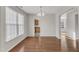 Dining area featuring hardwood floors and a decorative light fixture at 5609 Severn Grove Dr, Durham, NC 27703