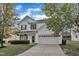 Charming two-story home with a two-car garage and a well-maintained lawn at 5609 Severn Grove Dr, Durham, NC 27703