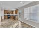 Bright kitchen featuring wood cabinetry and black appliances, adjacent to a dining area at 5609 Severn Grove Dr, Durham, NC 27703