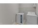 Laundry room featuring a washer and dryer with white cabinets at 5609 Severn Grove Dr, Durham, NC 27703