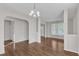 Open living area with hardwood floors and an archway at 5609 Severn Grove Dr, Durham, NC 27703