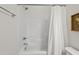 Bright bathroom featuring a shower, fresh white tile, and a shower curtain at 563 Great Ridge Parkway, Chapel Hill, NC 27516
