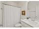 Clean bathroom featuring a shower with curtain, modern vanity, and ample natural lighting at 563 Great Ridge Parkway, Chapel Hill, NC 27516