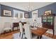 Stylish dining room featuring elegant decor, lighting, and an adjacent kitchen at 563 Great Ridge Parkway, Chapel Hill, NC 27516
