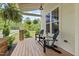 Cozy porch with chairs and decorative hanging plants for a relaxing outdoor space at 563 Great Ridge Parkway, Chapel Hill, NC 27516
