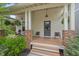 Inviting front porch with stone supports and seating, perfect for relaxing at 563 Great Ridge Parkway, Chapel Hill, NC 27516
