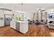Bright, open-concept kitchen and living area with hardwood floors at 563 Great Ridge Parkway, Chapel Hill, NC 27516