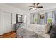 Comfortable main bedroom features hardwood floors, an ensuite bath, and ample natural light at 563 Great Ridge Parkway, Chapel Hill, NC 27516