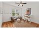 Bright office with hardwood floors, a standing desk, stylish chairs, and ample natural light at 563 Great Ridge Parkway, Chapel Hill, NC 27516
