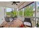 Relaxing screened-in porch with a dining set and comfortable seating, perfect for enjoying outdoor views at 563 Great Ridge Parkway, Chapel Hill, NC 27516