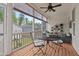 Charming screened-in porch featuring a dining table set and lovely outdoor views at 563 Great Ridge Parkway, Chapel Hill, NC 27516