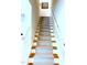 Elegant staircase featuring carpet runner, wooden steps, and white banister at 563 Great Ridge Parkway, Chapel Hill, NC 27516