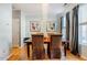 The dining room features hardwood floors, modern lighting, and large windows at 5710 Corbon Crest Ln, Raleigh, NC 27612