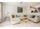 Inviting living room features tile floors and a comfortable sectional sofa with colorful decorative pillows at 5710 Corbon Crest Ln, Raleigh, NC 27612