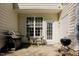 A cozy outdoor patio features a grill, table, and chairs perfect for relaxation at 5710 Corbon Crest Ln, Raleigh, NC 27612