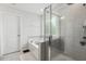 Bathroom featuring a tiled shower with glass doors, a garden tub, and neutral paint at 575 Dawley Dr, Fuquay Varina, NC 27526