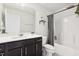 Bathroom featuring a modern vanity, mirror, and shower with shower curtain at 575 Dawley Dr, Fuquay Varina, NC 27526