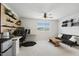 Spacious bedroom with a workstation, sofa, ceiling fan and large window at 575 Dawley Dr, Fuquay Varina, NC 27526