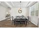 Elegant dining room with stylish light fixture and views to the backyard at 575 Dawley Dr, Fuquay Varina, NC 27526