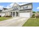 Charming two-story home featuring a two-car garage and covered front porch at 575 Dawley Dr, Fuquay Varina, NC 27526
