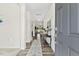 Bright foyer with wood-look flooring, a decorative rug, and elegant decor at 575 Dawley Dr, Fuquay Varina, NC 27526