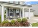 Inviting front porch with rocking chairs, complemented by well-manicured landscaping and a two-car garage at 575 Dawley Dr, Fuquay Varina, NC 27526