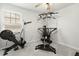 Home gym featuring exercise equipment and a window with blinds at 575 Dawley Dr, Fuquay Varina, NC 27526