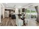 Eat-in kitchen with stainless steel appliances, island, dining area and sliding glass doors to the patio at 575 Dawley Dr, Fuquay Varina, NC 27526