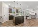 Open concept kitchen with a central island, stainless appliances and view to the backyard at 575 Dawley Dr, Fuquay Varina, NC 27526