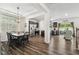 Open-concept kitchen with modern stainless steel appliances and dark wood cabinets at 575 Dawley Dr, Fuquay Varina, NC 27526