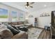 Cozy living room with a comfortable sectional sofa, ceiling fan, and ample natural light at 575 Dawley Dr, Fuquay Varina, NC 27526
