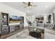 Open-concept living room and kitchen with stylish furnishings, decor and open floor plan at 575 Dawley Dr, Fuquay Varina, NC 27526