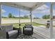 Relaxing screened patio with outdoor seating overlooking a fenced backyard at 575 Dawley Dr, Fuquay Varina, NC 27526